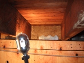 L-90 Simpson shear clip properly placed in the joist bay